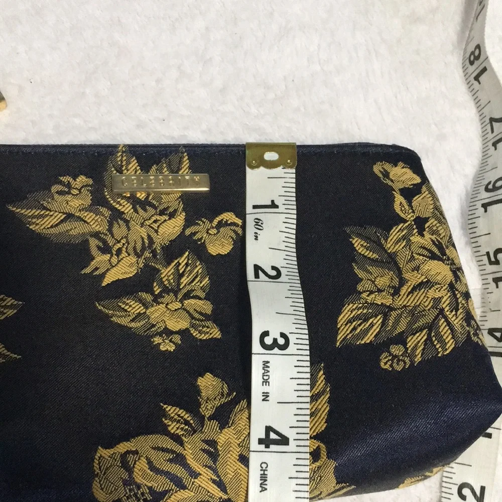 Celebrity travel bag and matching makeup bag. Navy blue with gold flowers